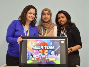 group pic Three woman holding the megateam logo displayed on a screen.