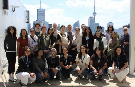 IMG_9067 Group photo of people standing in front of the Toronto skyline.