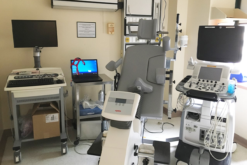 The bicycle stress echo equipment room with specialized bicycle that reclines and tilts, ultrasound machine and electrophysiology equipment.