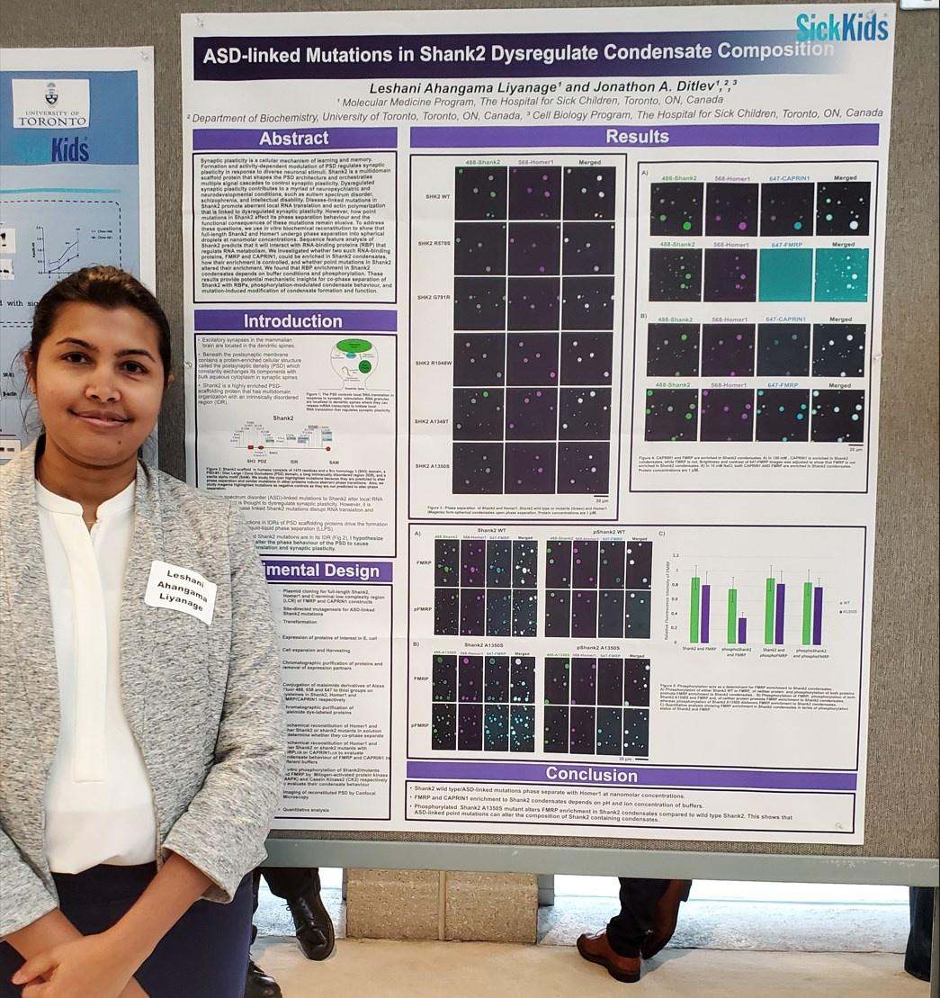 Dr. Leshani Ahangama Liyanage standing in front of her research poster.