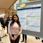 Lauren Tailor standing in front of her poster