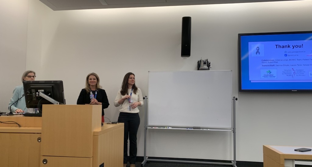 Kate (left), Dr. Grandi (middle), and Yanara (right) in front of their presentation at the CHES Rounds at SickKids