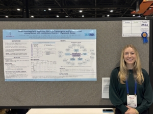 A photo of medical student, Olivia Novosel, presenting at the American College of Rheumatology conference 2025, in Chicago Illinois
