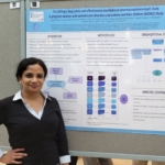 Jathishinie standing in front of her poster