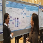 Jathishinie talking about her poster with an attendee