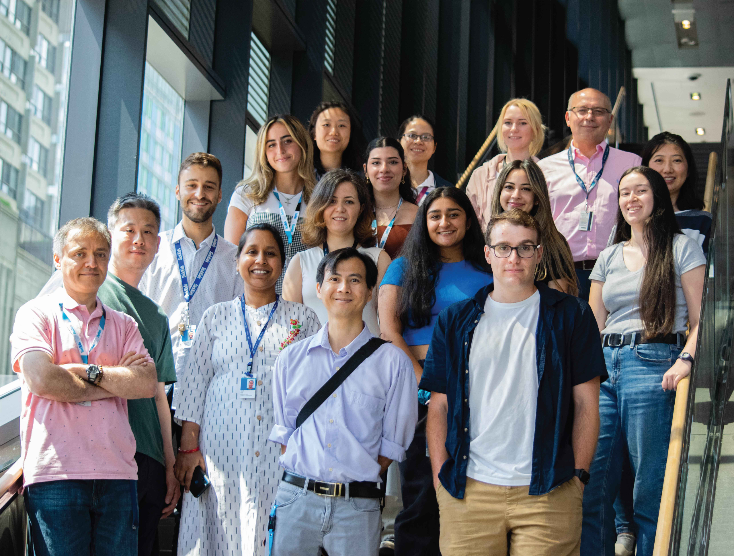 A group image of all members of the Ivakine Lab posing for a photo on a staircase in the PGCRL