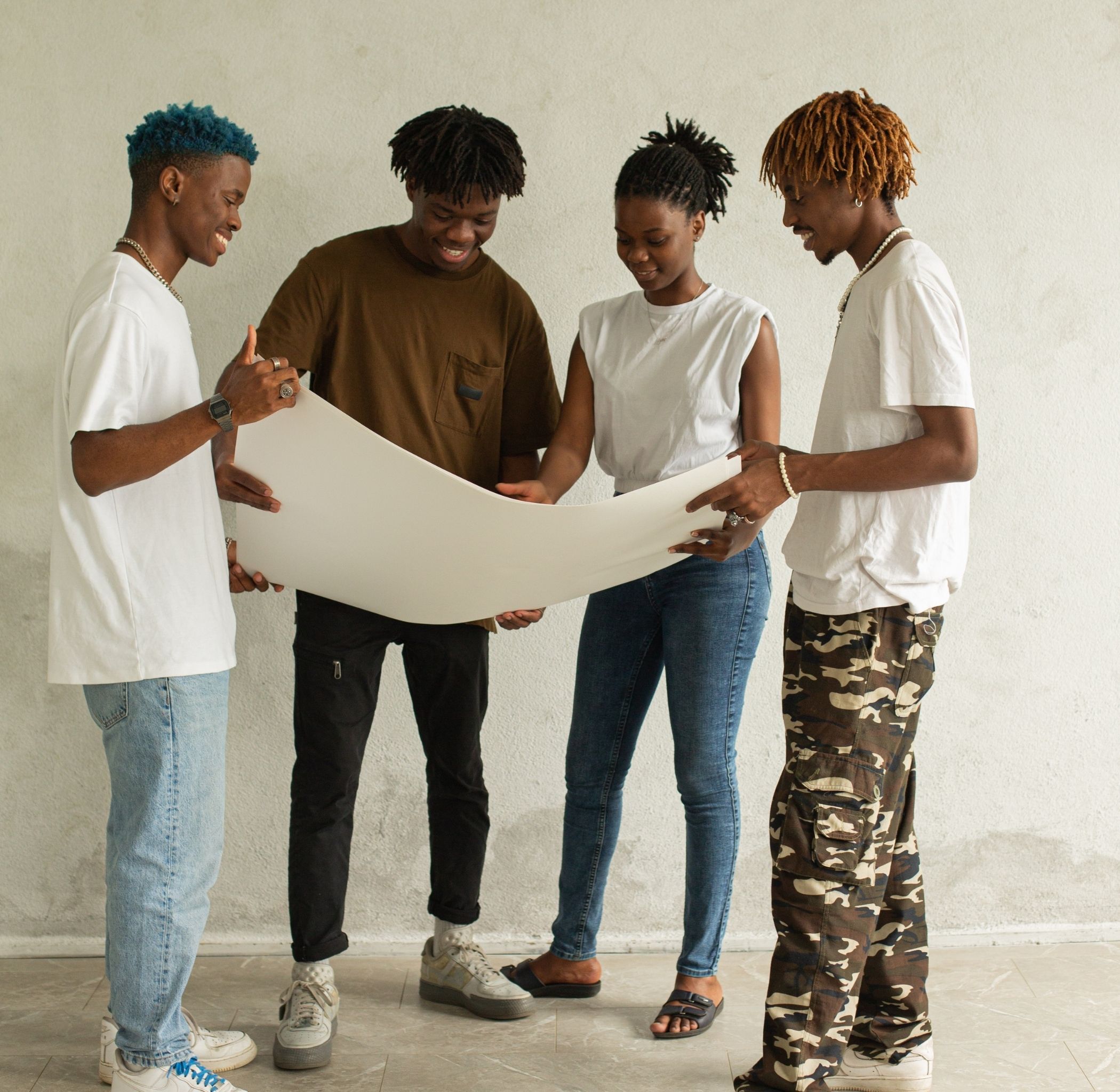 a group of black youth working in a project together