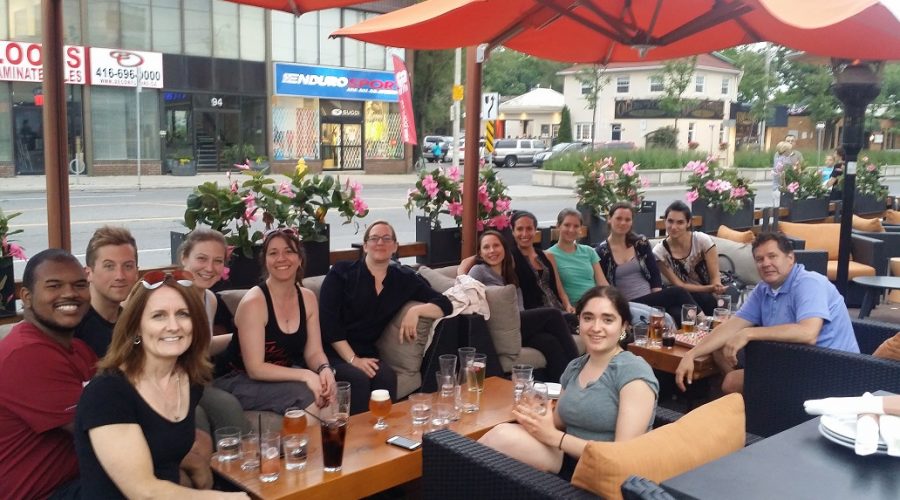 Group photo of lab team at dinner during summer social outing