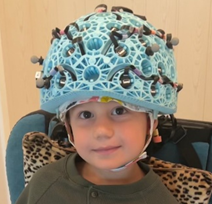 Child Wearing Blue OPM-MEG Helmet