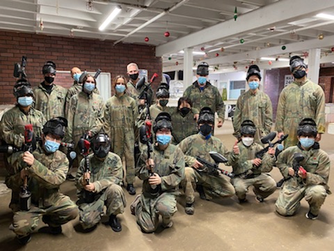 Group photo of lab members at paintball