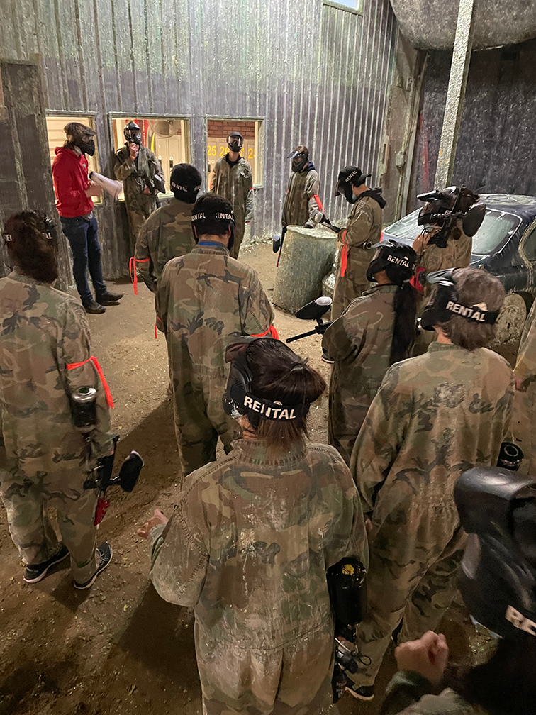 Group photo of lab members at paintball