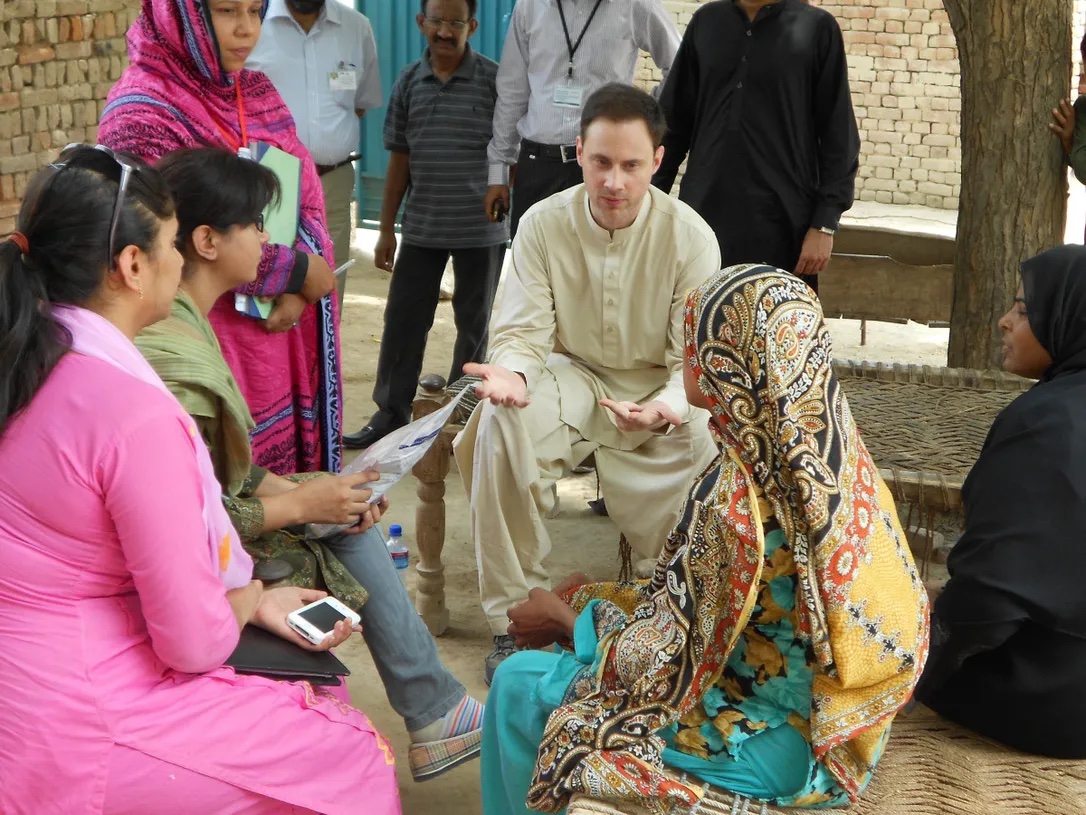 Dr. Shaun Morris speaking with a group of women in Pakistan.