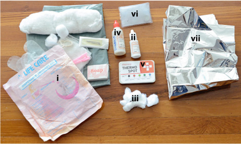 The neonatal kit includes a i) clean delivery kit, ii) 4% chlorhexidine solution that is to be applied with iii) cotton balls, iv) sunflower oil emollient, v) ThermoSpot, vi) a reusable instant heat pack, and vii) a Mylar infant blanket.