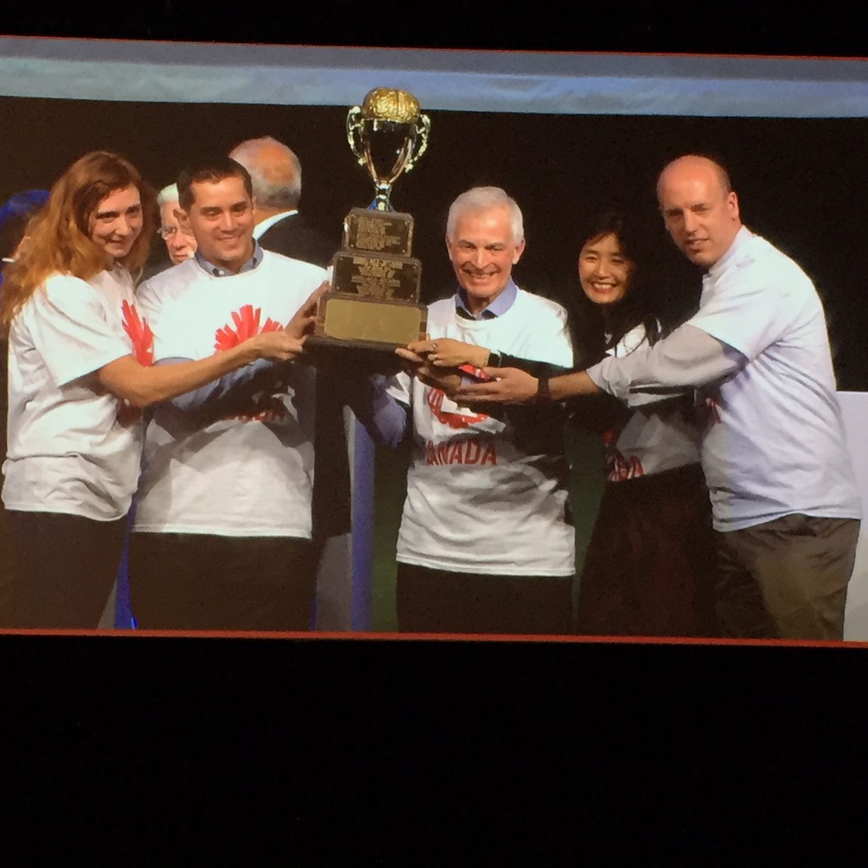 Photo of Ann and others receiving the Neurobowl