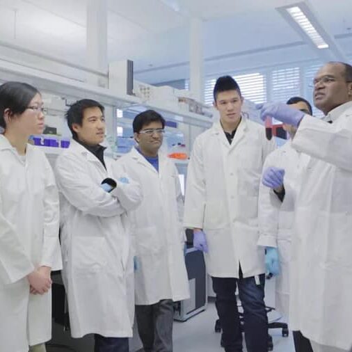 Dr. Palaniyar teaching his students in his lab