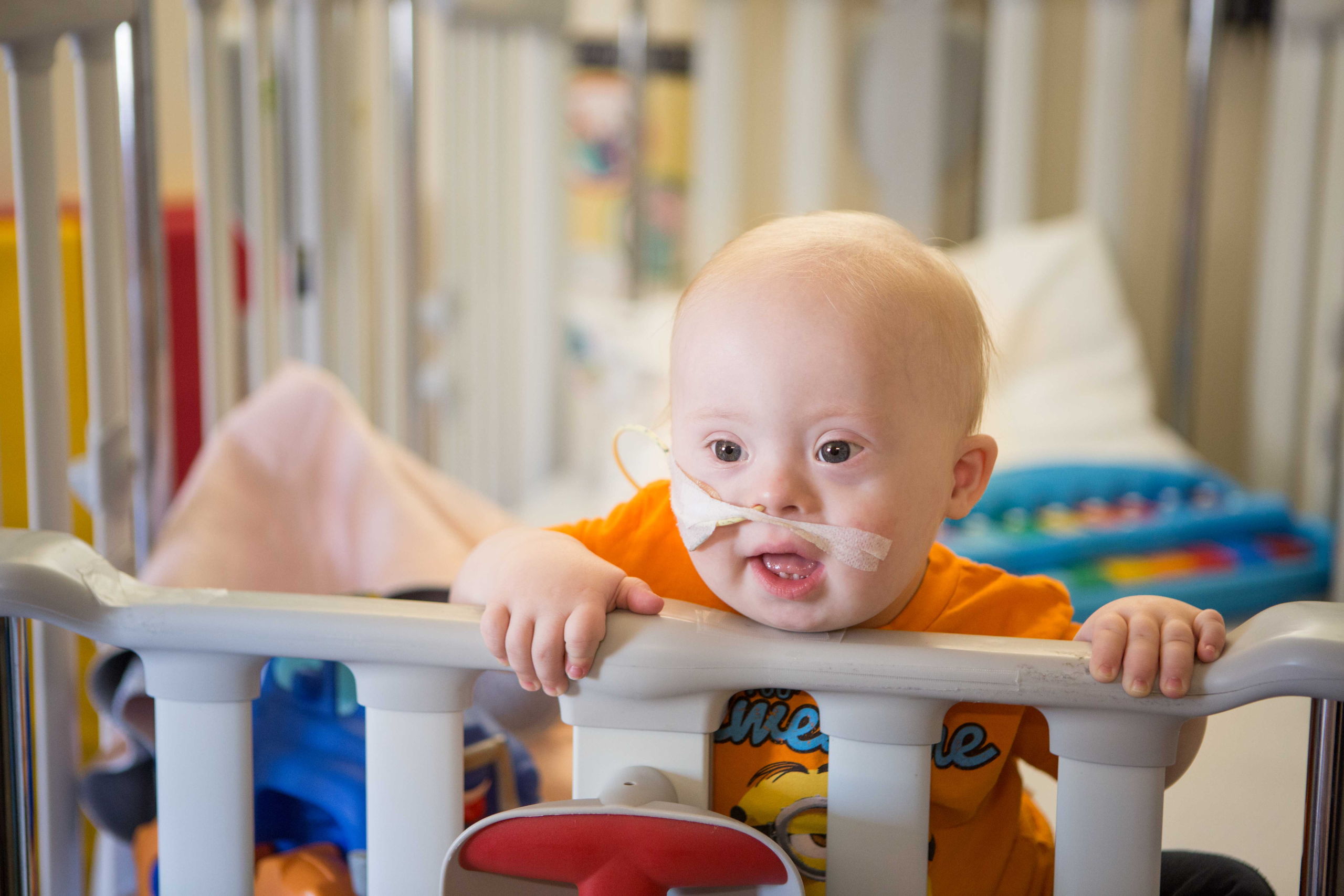 Young cancer patient in inpatient crib