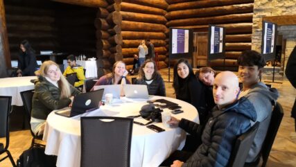 7 Tabori lab members posing at a table