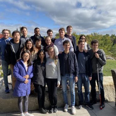 Lab members gathered together for a photo taken outside during the fall