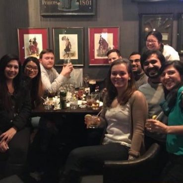 Lab members sitting around a table at a restaurant
