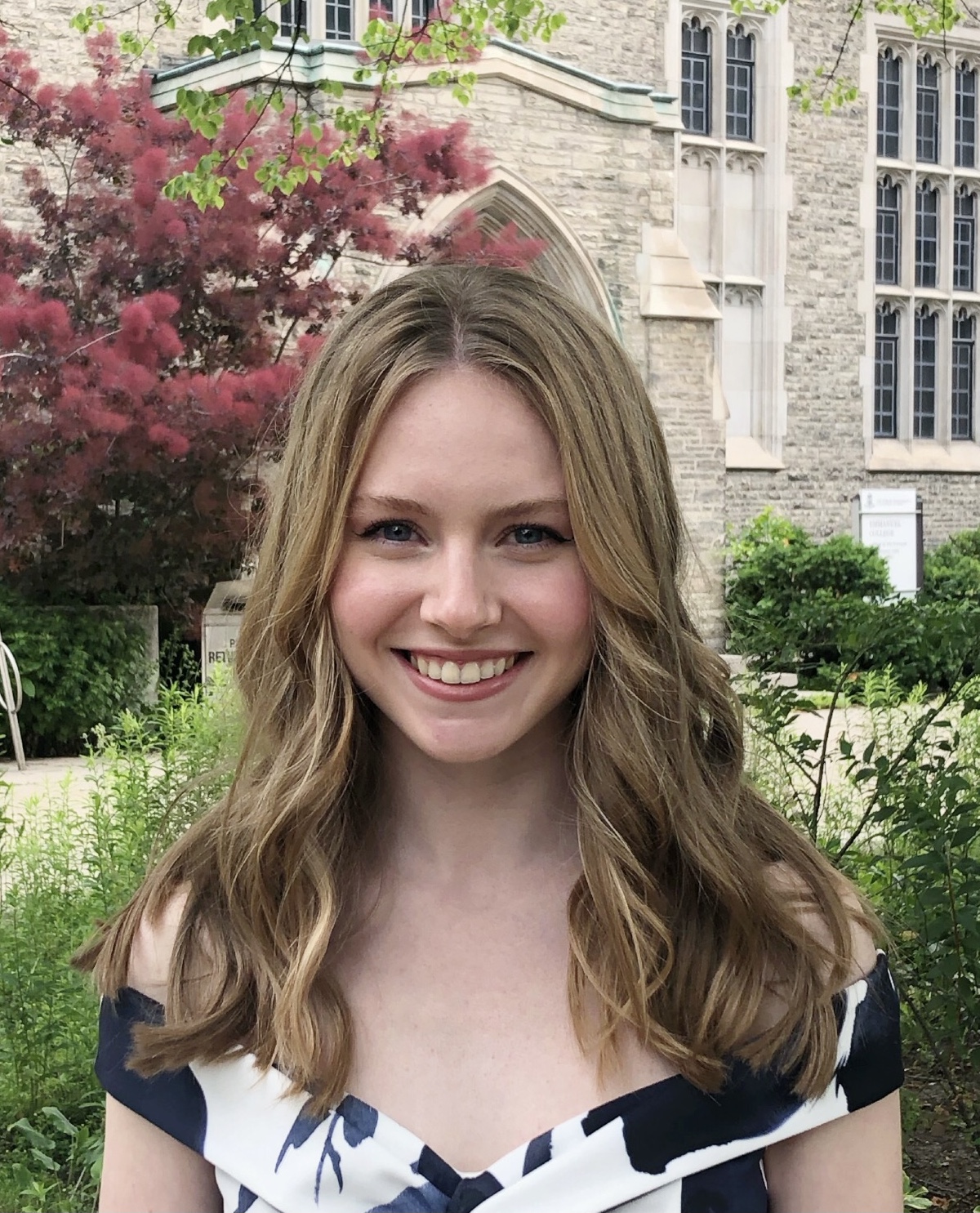headshot of Carina Lyons smiling at the camera