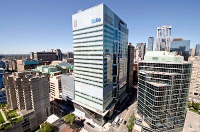 Photo of PGCRL, a medium sized grey office building with the logo SickKids on the top