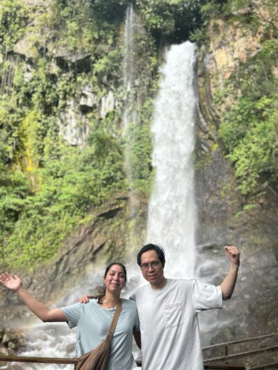 IMG_8495 Dr. Yuan and his PhD student standing in front of waterfall
