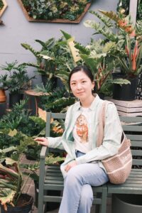 DSCF5227 2 Anita Yin holding flowers at University of Toronto graduation